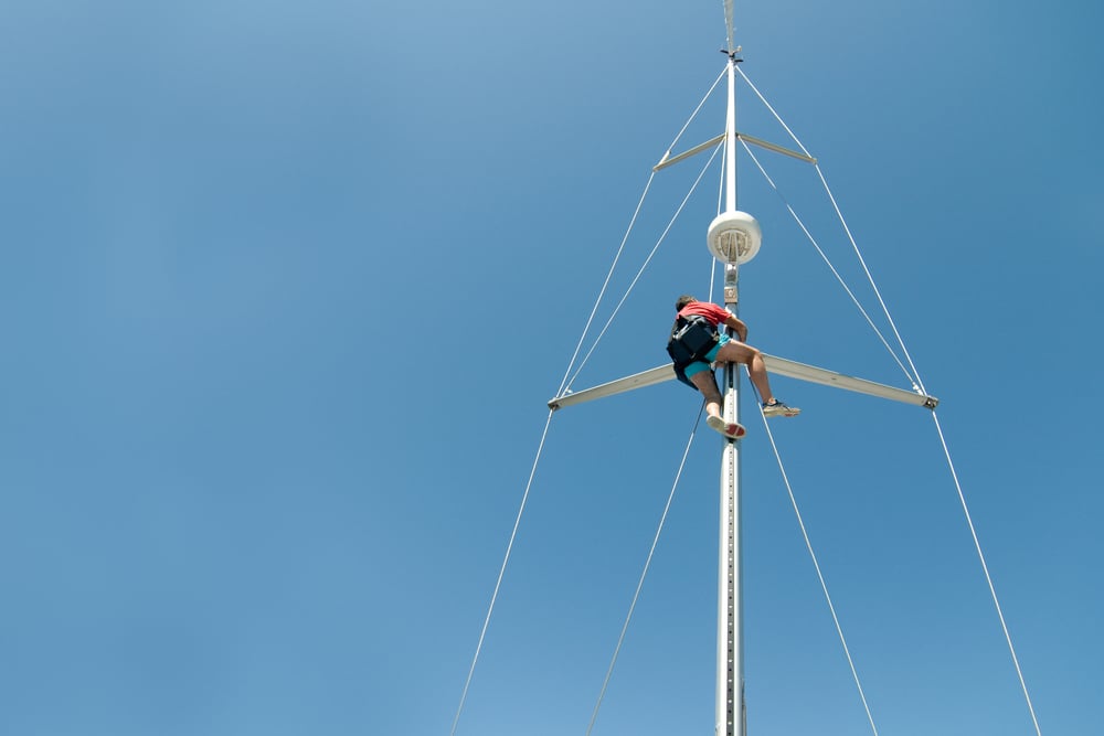 Yacht rigger making repairs to a mast in Richmond